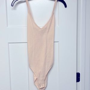 Striped white and pink bodysuit.